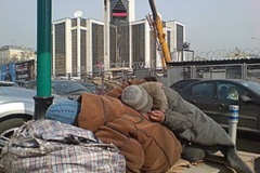 275px-Beggars-sleep-near-the-LUKOIL